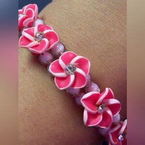 Pink Plumeria stretch bracelet with gem stones.
